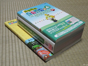 本『とびだせ どうぶつの森 村長さんのスケジュール＆アイテムブック2014』の厚さを、他の関連本と比較